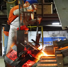 Worker On Pouring Platform | Midland MFG Co.